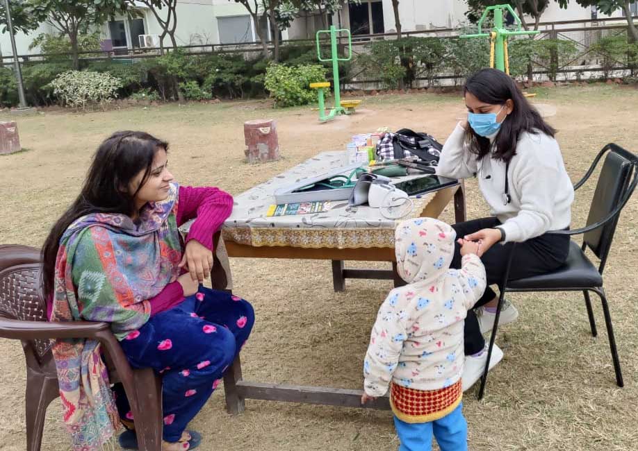 Patients receiving free homoeopathic medicines at a Covid-19 community camp